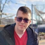 Man wearing sunglasses outdoors on sunny day